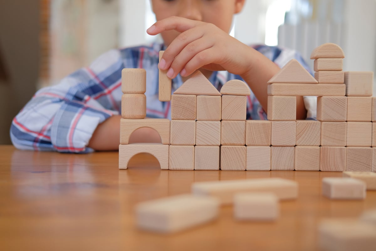 Child Playing with Geometric Blocks